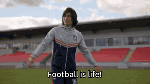 A GIF of scene from Ted Lasso with Danny Rojas in the field cheerfully saying "Football is life!"